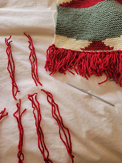 Ran out of my Patons scarlet yarn when making tassels, so used some scrap yarn from another project to mix in - it isn't too noticeable I think