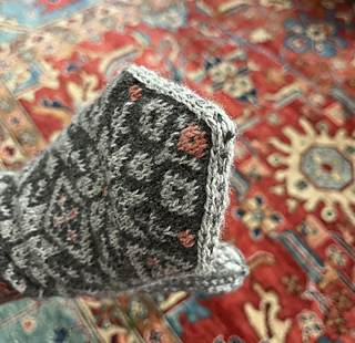 Tip grafted over peak and duplicate stitched details 