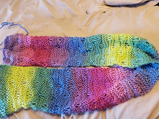The completed scarf in a variety of colors