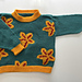 Age 4 (110cm). Duplicate stitch finish.