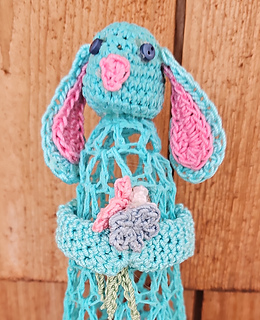 Modern spring bunny holding flowers.