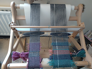the setup including thrums bundles tied to the loom