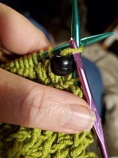 Crochet hook used to add beads