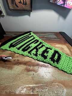 Wicked pennant flag lays flat on a desk