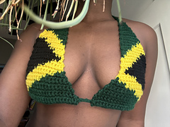 model wears Jamaica flag bikini top