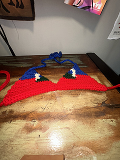 Haiti bikini top lies on a desk
