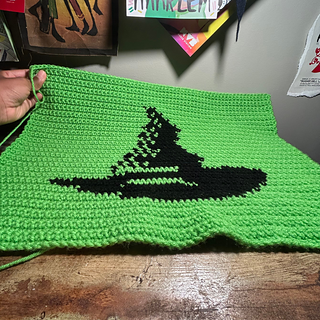 Tapestry lies flat on a desk