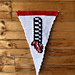 Crochet pennant flag features image of the legs of the Wicked Witch of the East, Nessarose