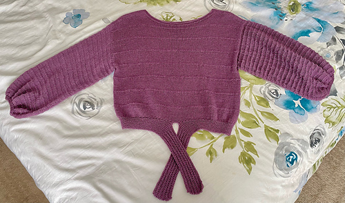 Body and right sleeve steam-blocked; left sleeve unblocked. 