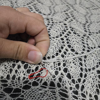 Securing the dropped stitch and duplicate stitching to fix the issue