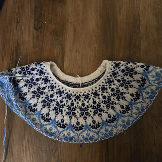 The yoke after adding more short rows to the back. You can see the back now sits about an inch higher than before.