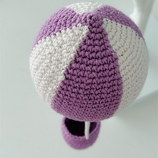 The design features a chunky asymmetric swirl. 