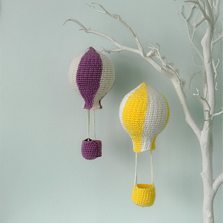 Hot air balloons can be hung individually and look great from twig trees. 