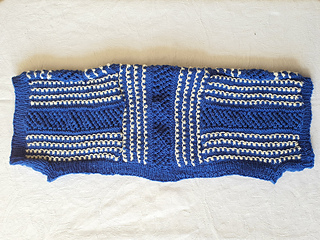 Blue and white knitted shrug folded
