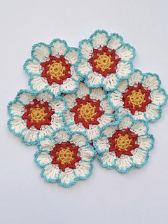 set of six crocheted yellow, red white and turquoise flower coasters