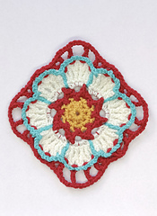 crocheted yellow, red white and turquoise flower square