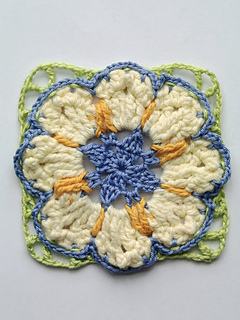 crocheted yellow, cream, blue and green flower square
