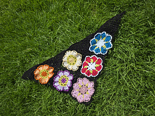 Black lace neckerchief with bright floral granny squares laid flat