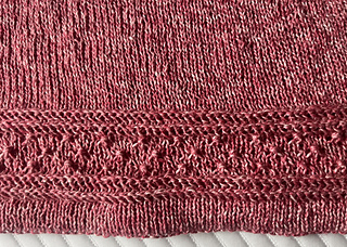 Folded hem with Estonian button stitches and lateral braids