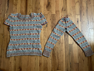 Mid surgery: I unraveled the original sleeves the round before the join, and re-knit them as conjoined twins following the basted line of where the caps would like to be.