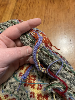 Unpicking the cast on and extra rows of the new front.