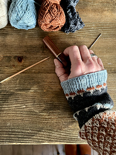 image shows the matching wrist warmers