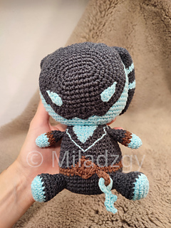 Thresh from League of Legends, crochet toy made by amigurumi technique. Used dark grey, turqoise and brown yarn. Front side, held in hand.
