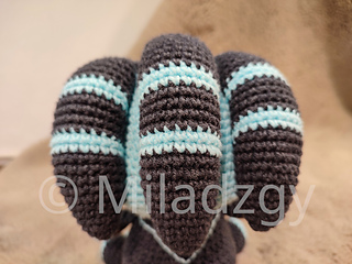 Thresh from League of Legends, crochet toy made by amigurumi technique. Used dark grey, turqoise and brown yarn. Upper side, appendages view.