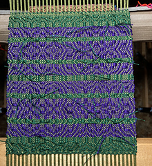 Purple and forest green, tabby and pattern wefts are the same color.