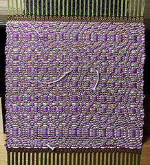 Polychrome. Kelp warp, burnt umber tabby weft, super pale pink and verbena pattern wefts.