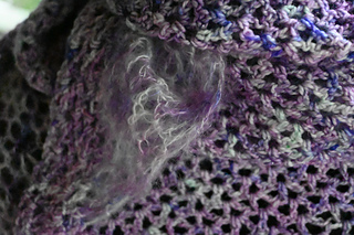 another close up at night of the two yarns as they work together 