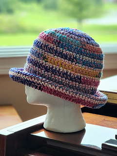 Lion Brand 24/7 Cotton base paired with Caron Cupcakes & off white yarn remnant.