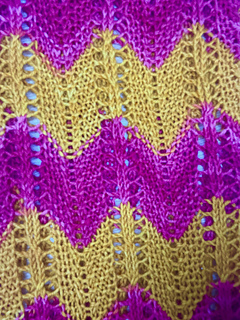 close up of scarf on side with cables