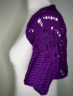 side view with sleeve of madeira shrug on dress form