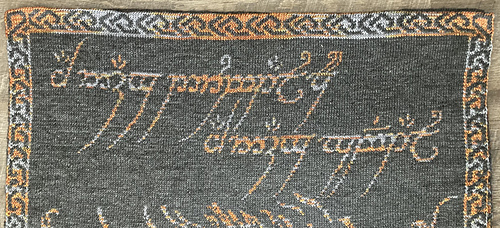 Eye of Sauron Double Knit Blanket showing top edge of Black Speech side