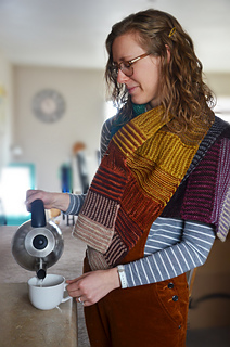 Rachel wearing gradient wrap, pouring tea