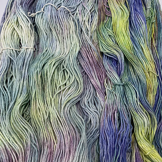 This is a comparison of Cotton Kiss (left) and a 100% superwash merino yarn base (right) to demonstrate the muted quality of the colorway. 