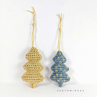 Handmade crochet Christmas trees, showcasing the perfect amigurumi project to use up yarn scraps!