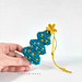 Handmade crochet Christmas tree with imitation garland and "star" on top, showcasing the result of a detailed amigurumi pattern.