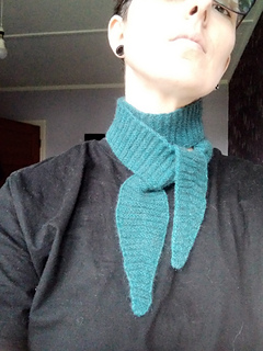 Made with 40gm possum/wool blend fingering weight yarn on 2.75mm needles. Easily wraps twice around the neck with length for a loose knot.