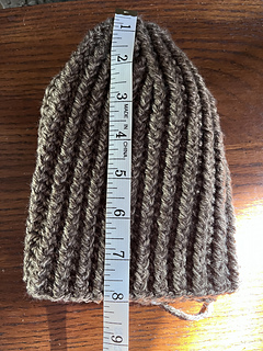 After folding in fourths, measured before doing final sc round, 8”.