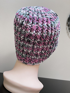 Surprise stripe other side (heavier weight), one extra set of increase rounds, 8.5” tall, 122 grams.  The black sections only came through on one side - do not recommend this colorway for this pattern.