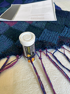 Using the plastic vial method to evenly tie the knots. 