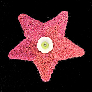 Same pattern, same needles with FIVE petals with Kroy Socks yarn. Blocked after sewing flower together