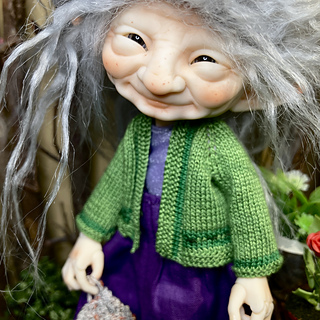 Cotton doll sweater for Spring is worked in one piece from the neck down.