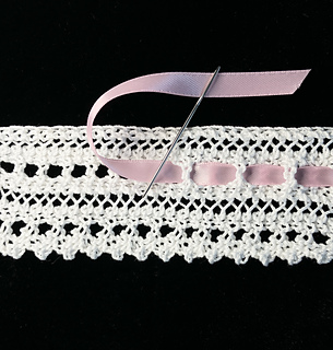 A ribbon can also be woven into the bottom eyelets, if desired.