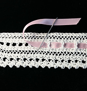 A ribbon can also be woven into the bottom eyelets, if desired.